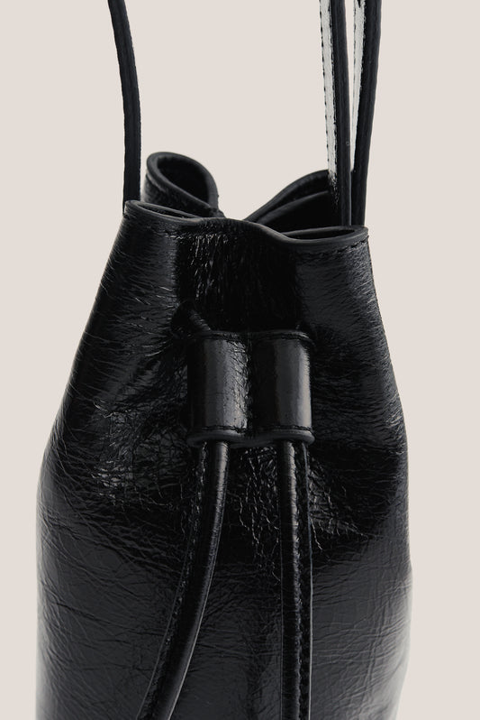 Women's accessories mini round bucket bag, black lwg-certified calf leather with drawstring closure.