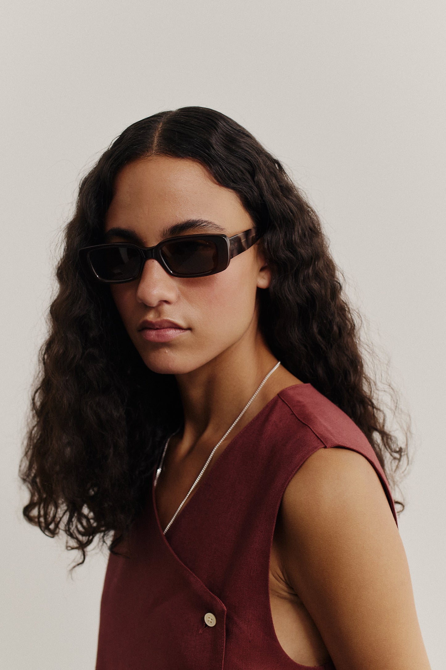 Women's accessories, Odessa sunglasses, brown acetate, wide and narrow frames, dark lenses.