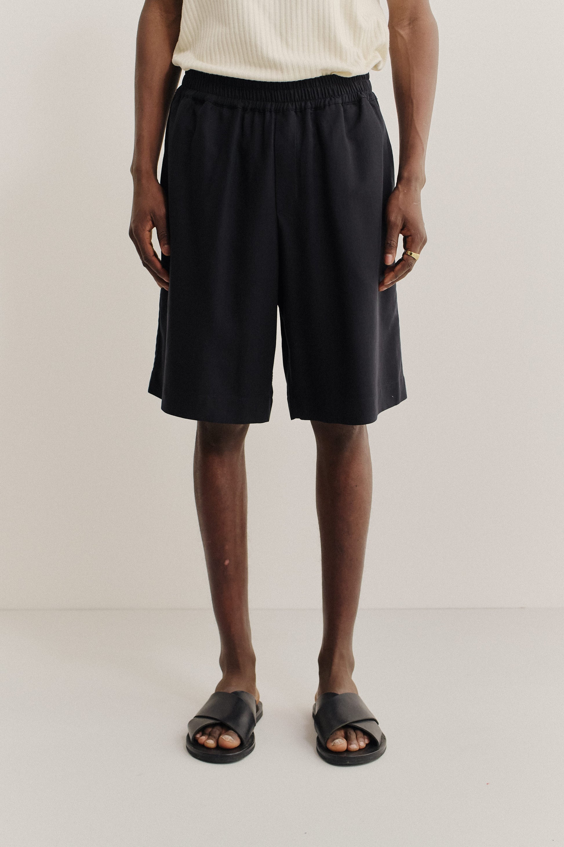 Men's shorts, lyocell heavy twill, soft black, wide leg, elastic waist, side pockets.