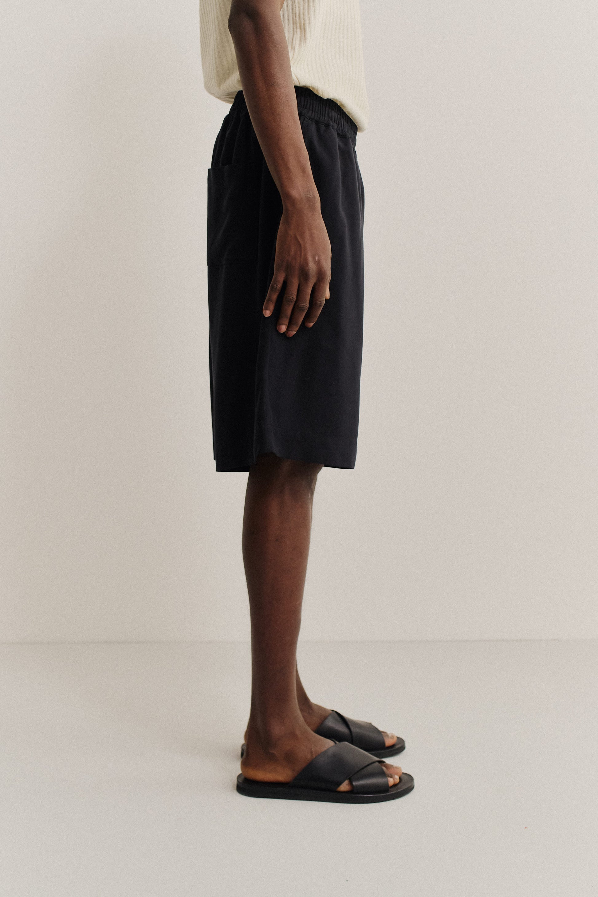 Men's shorts, 100% lyocell heavy twill, soft black, wide leg with elastic waist and side pockets.