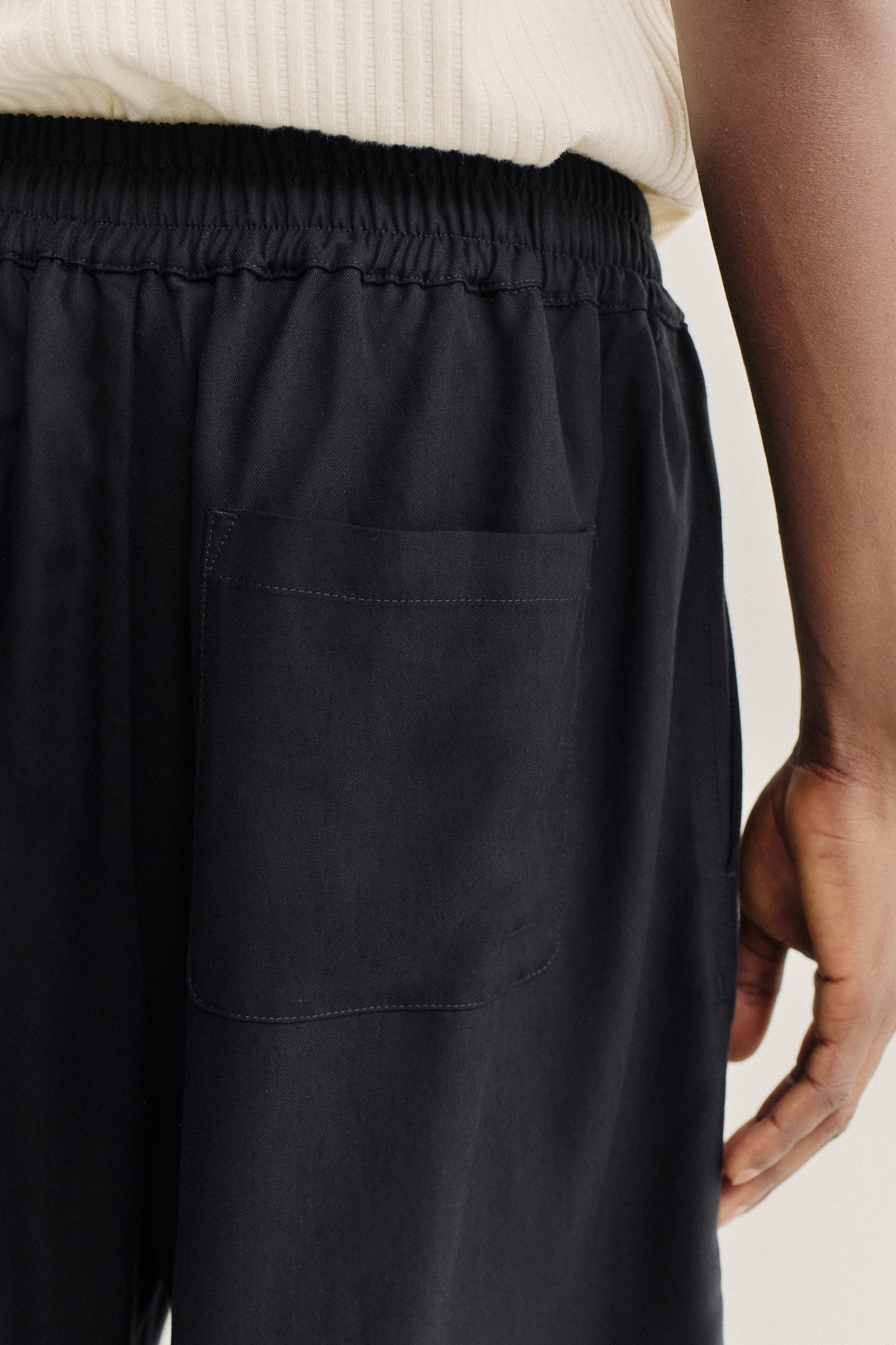 Men's shorts, lyocell heavy twill, soft black, with elastic waistband and back patch pocket.