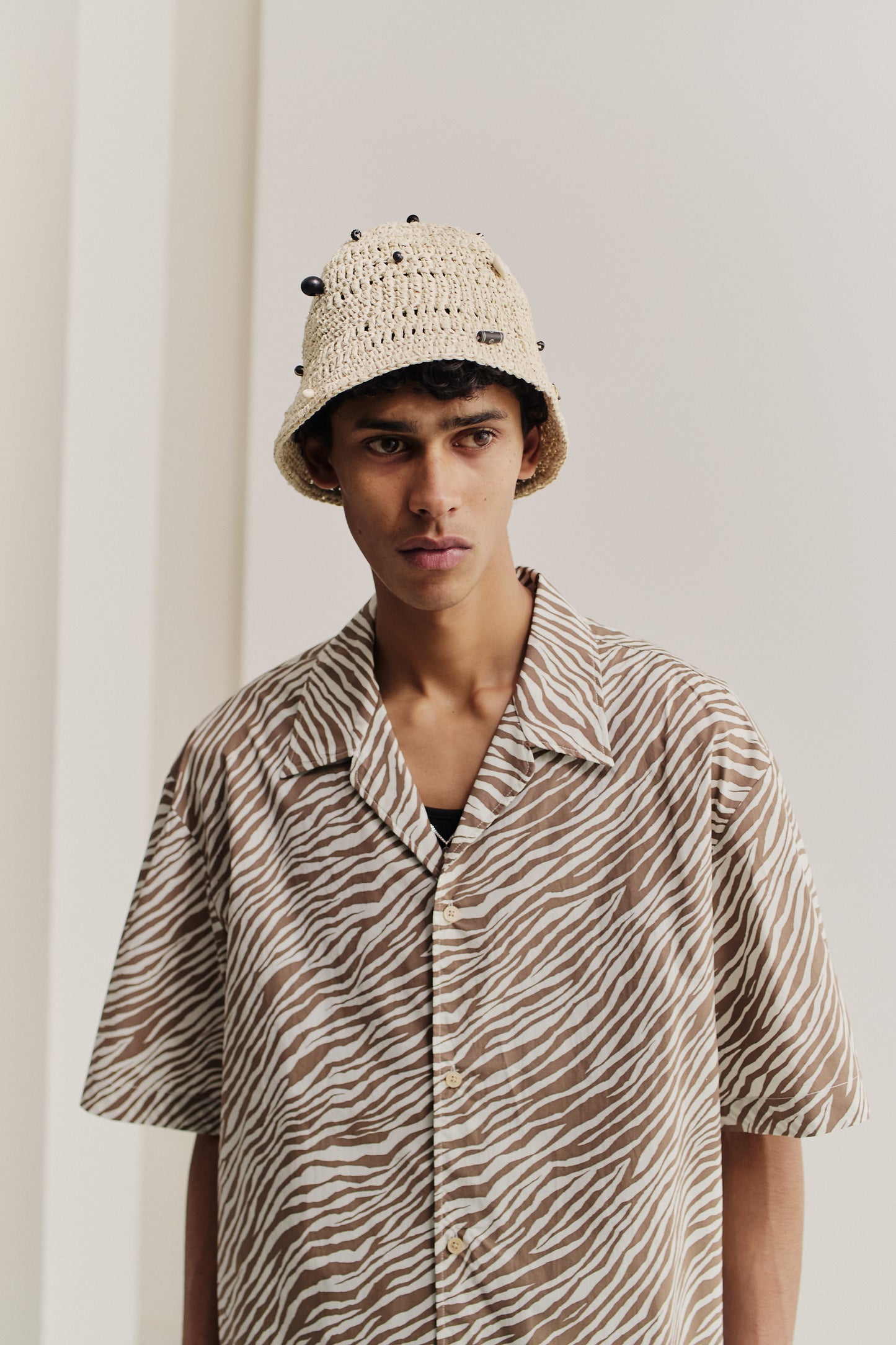 Men's short-sleeved shirt, cotton blend, zebra-inspired stripe, brown and white, notched collar.