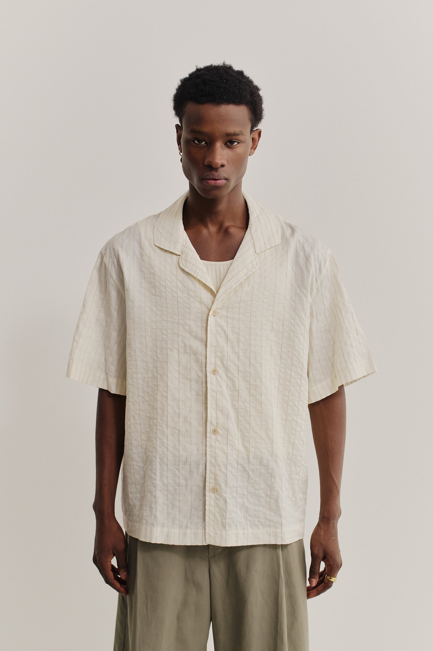 Men's short-sleeved shirt, cotton-silk-linen blend, washed, cream with subtle stripes.