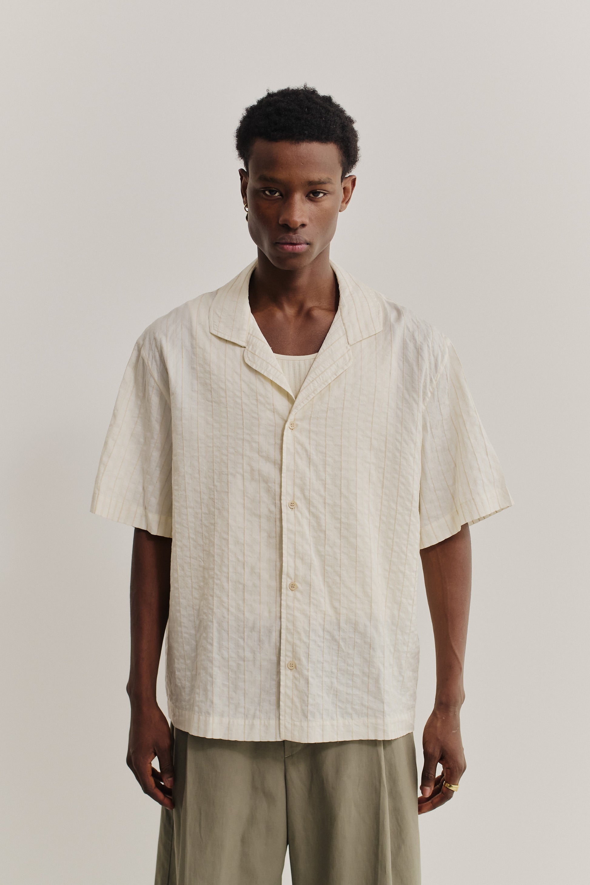 Men's short-sleeved shirt, cotton-silk-linen blend, washed, cream with subtle stripes.
