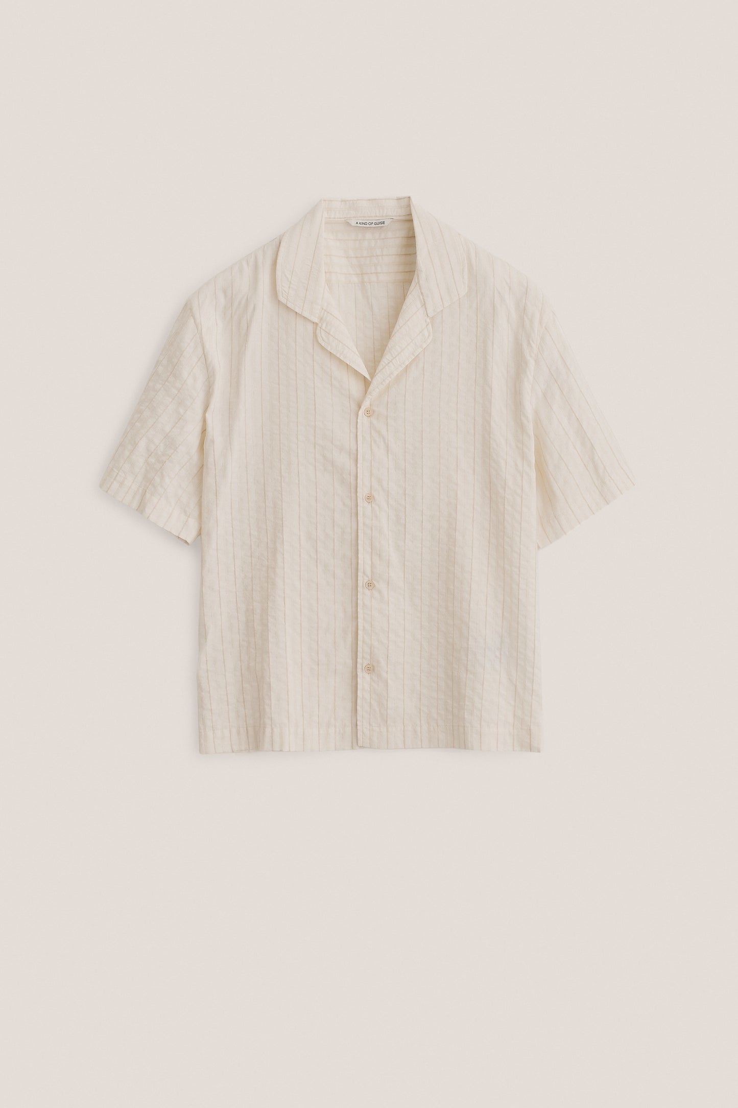 Men's short-sleeved shirt, cotton-silk-linen blend, washed, light beige with subtle irregular stripes.