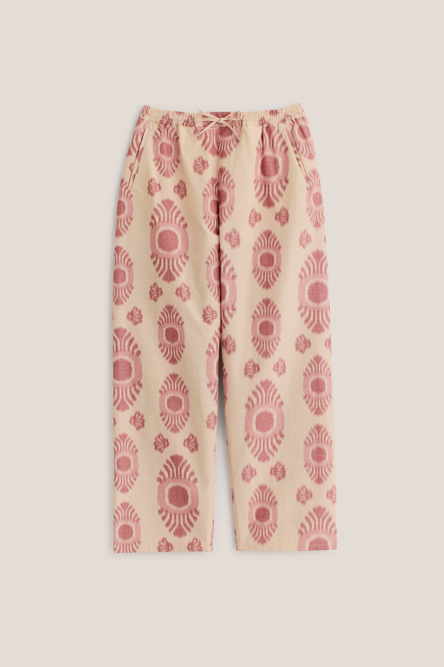 Men's long-pants, cotton and recycled polyester blend, ikat print, beige with red pattern, elastic waist.