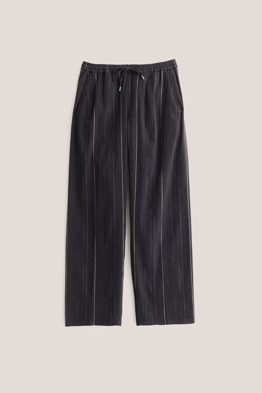 Men's long pants, black cotton-linen blend with subtle white stripes, elasticated waistband, and wide straight fit.
