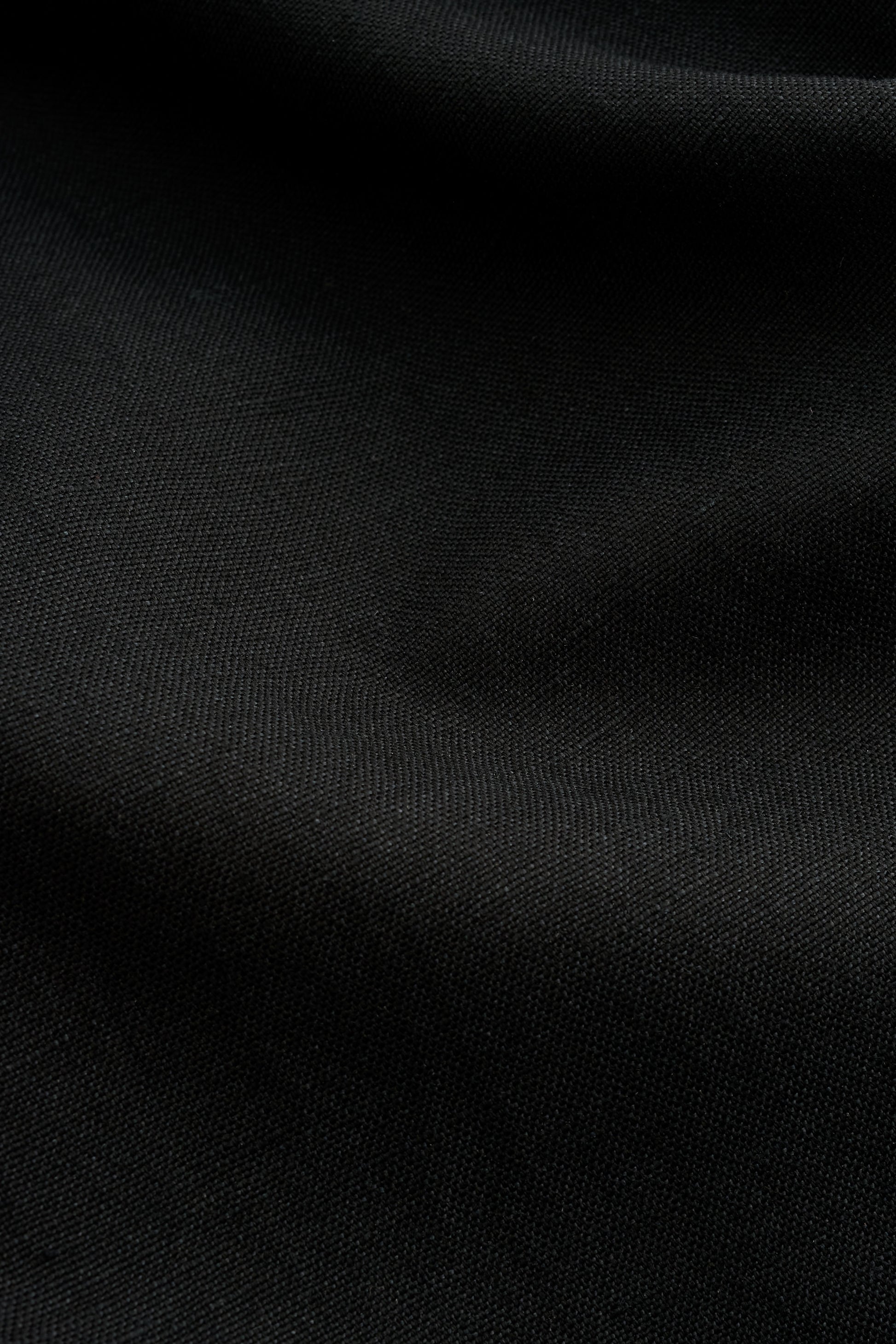 Men's pants, long-pants, worsted wool and linen blend, black, with subtle texture.