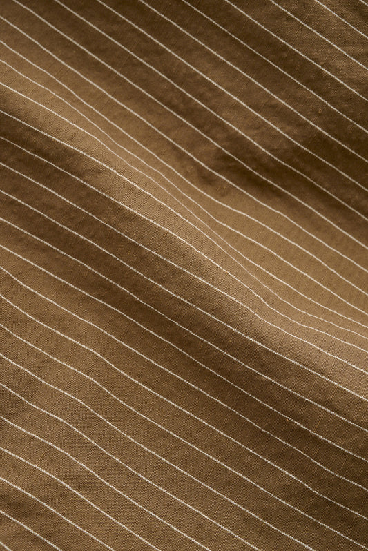 Men's long-pants, cotton-linen seersucker, brown with fine pinstripes.