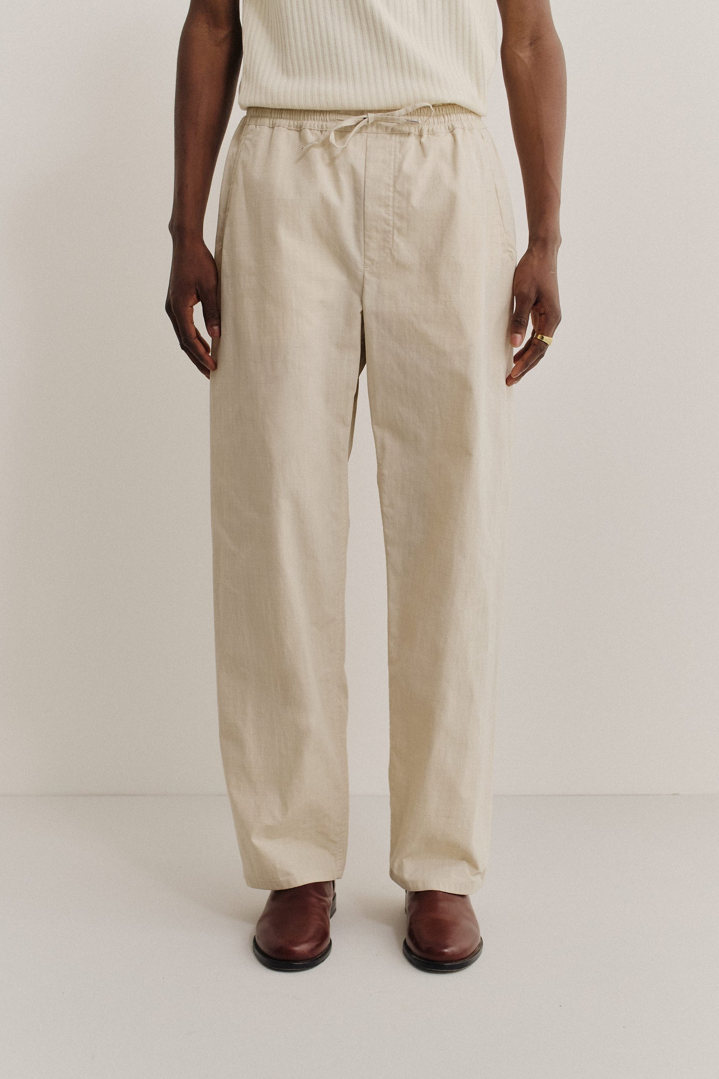 Men's long-pants, cotton blend ripstop, natural beige, with elastic waist and welt pockets.