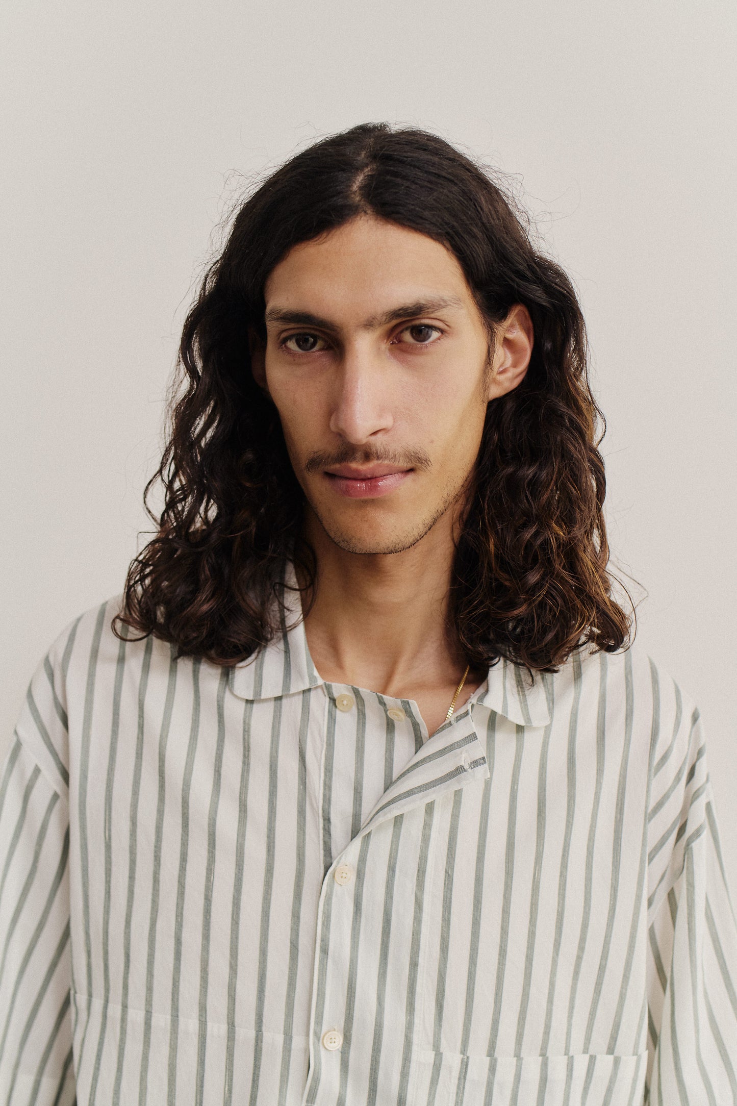 Men's short-sleeved shirt, cotton-silk-linen blend, washed, white with subtle green stripes.