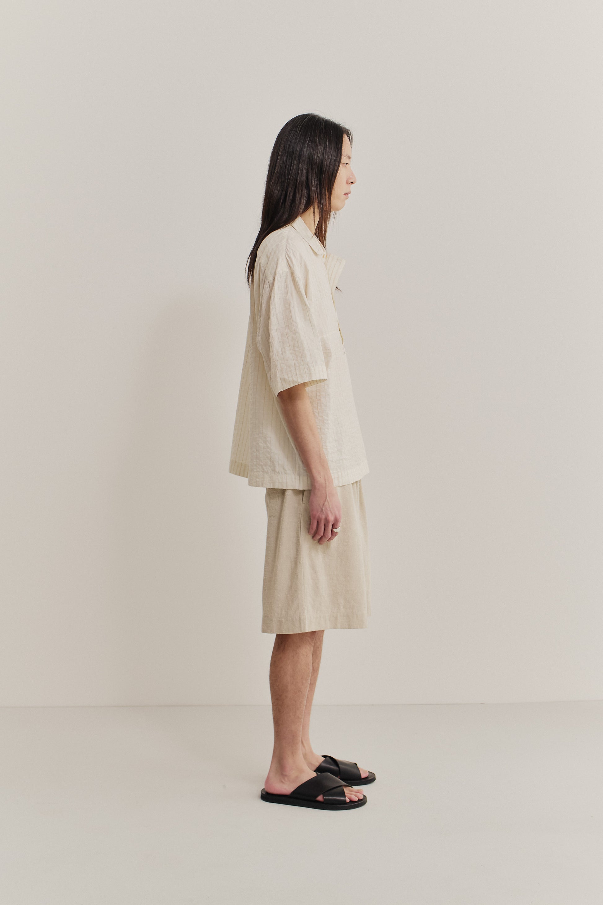 Men's short-sleeved shirt, cotton-silk-linen blend, washed, cream with subtle stripes.