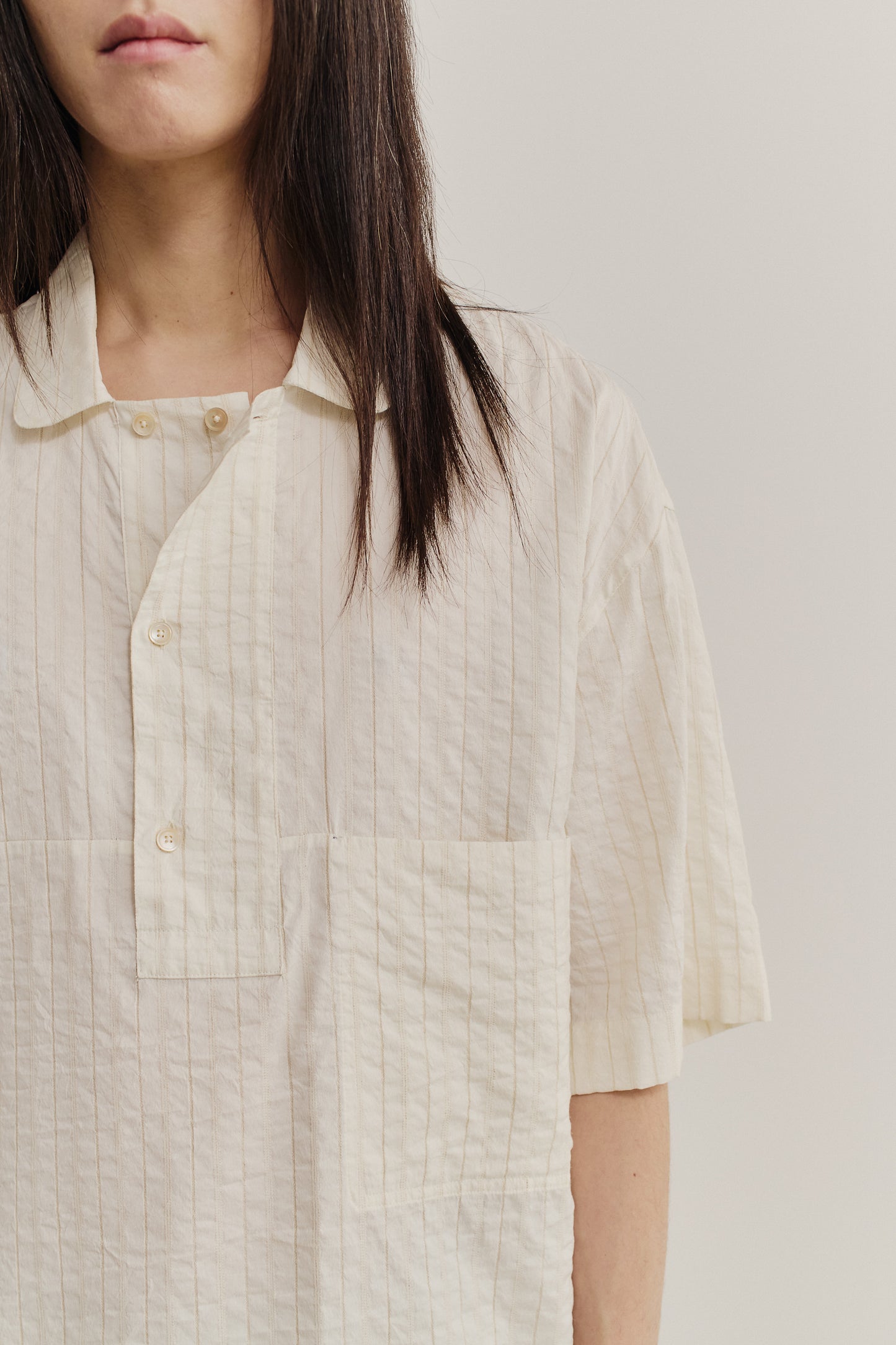 Men's short-sleeved shirt, cotton-silk-linen blend, washed, off-white with subtle irregular stripes.