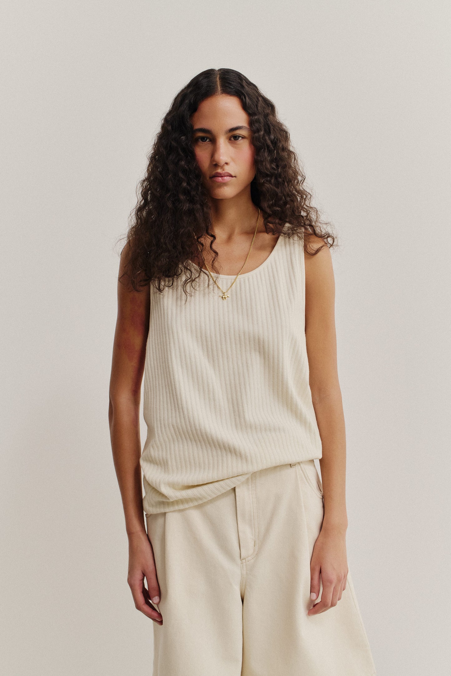 Unisex jersey tanktop, off-white cotton rib with pointelle detailing, wide scooped neckline.