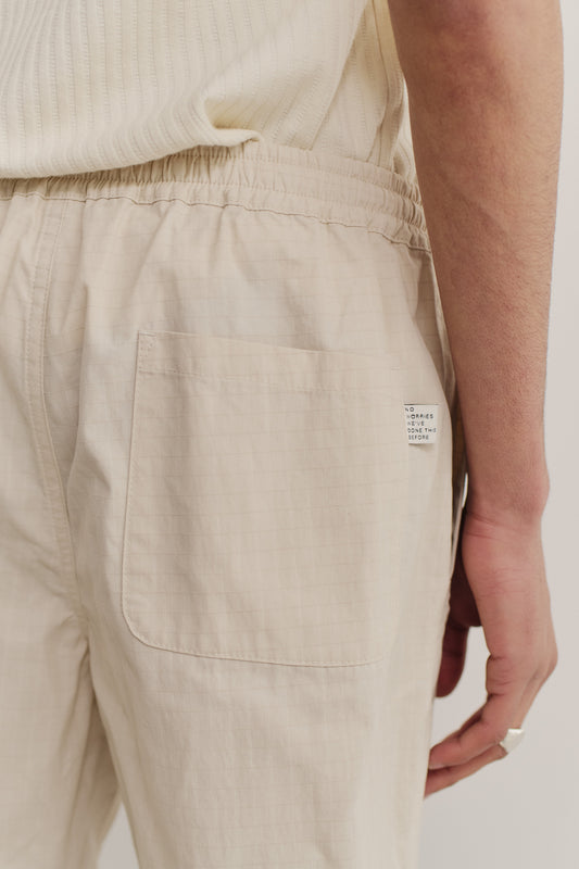 Men's shorts, cotton blend ripstop, beige, with elastic waist and back patch pocket.
