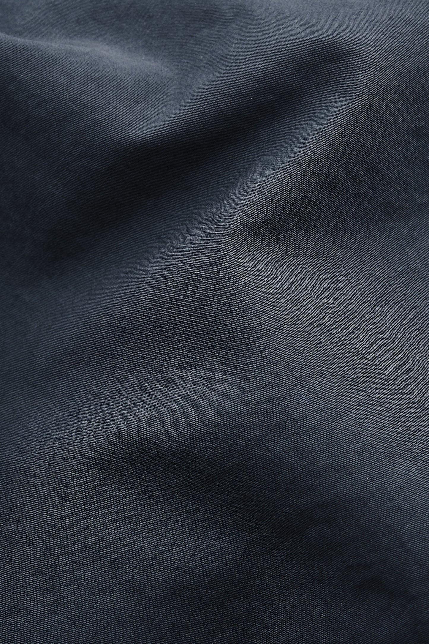 Men's shorts, cotton-linen blend, garment dyed navy, with natural structure and soft hand feel.