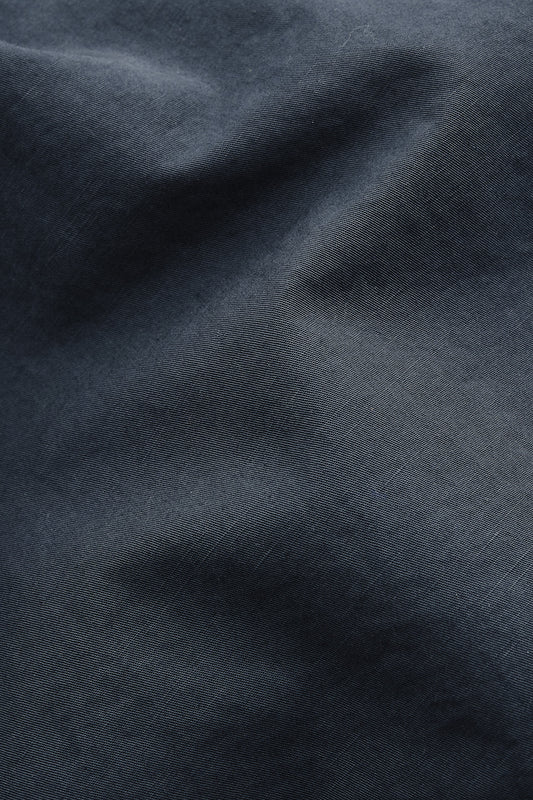 Men's shorts, cotton-linen blend, garment dyed navy, with natural structure and soft hand feel.