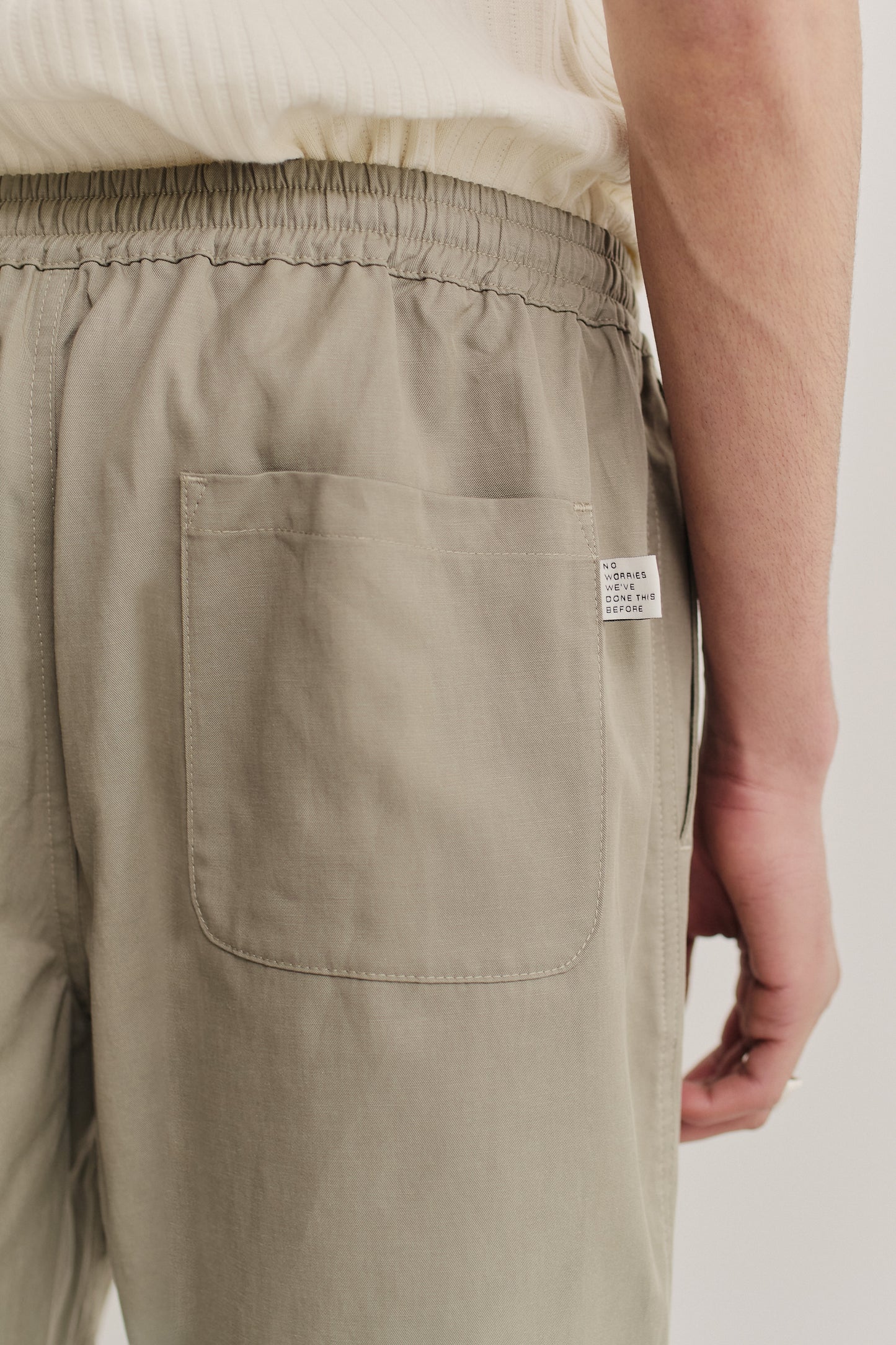 Men's shorts, lyocell-cotton-linen twill, sun-bleached sage, with elastic waist and back patch pocket.