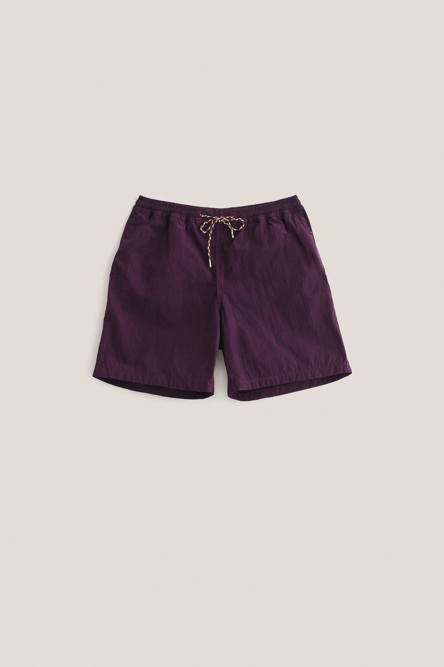 Men's shorts, recycled polyamide, garment-dyed purple, with an adjustable drawstring waistband.