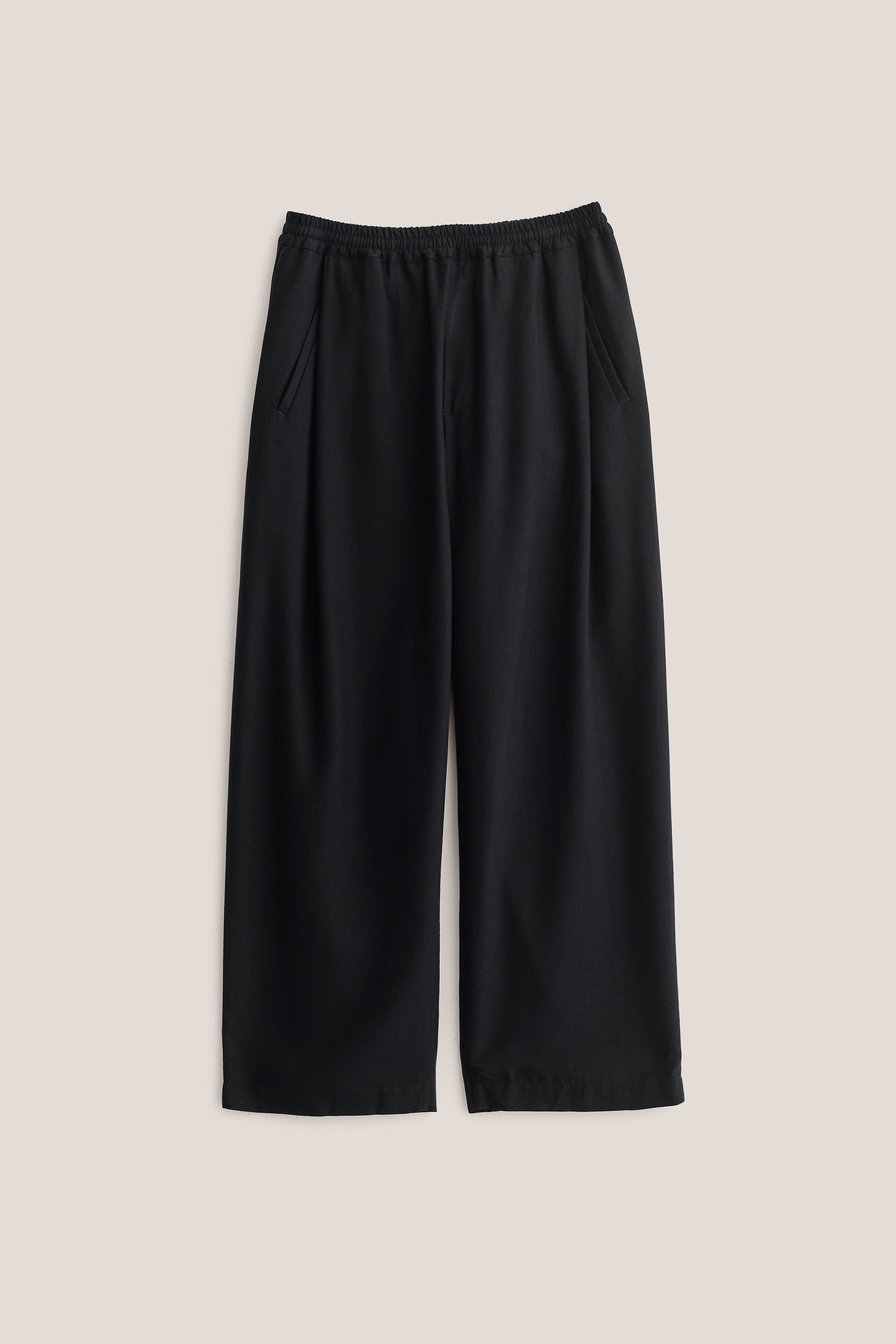 Men's pants, wide-leg, 100% lyocell heavy twill, deep black, elastic waist, front pleats, slanted welt pockets.