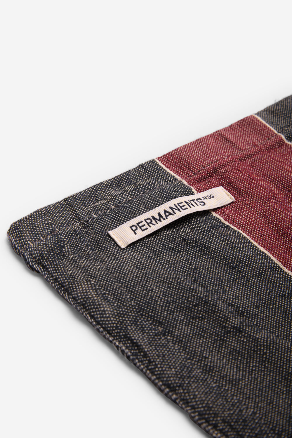 Accessories beach towel, linen-cotton mix, red and navy stripe, with "PERMANENTS" label.