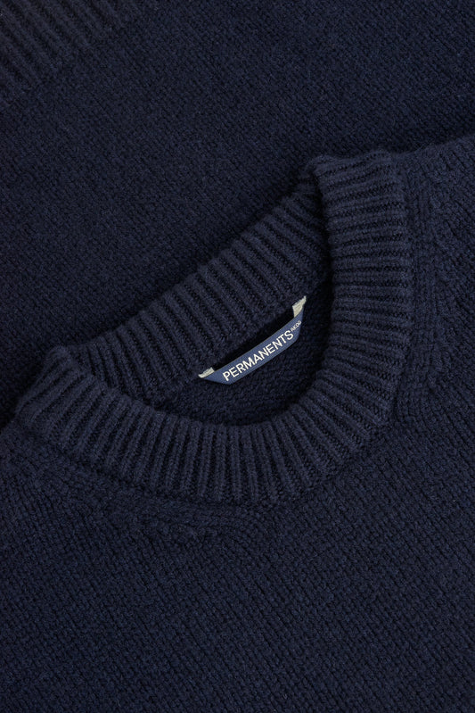 Men's knit pullover, navy merino wool-cashmere blend, with ribbed neck and PERMANENTS® label.
