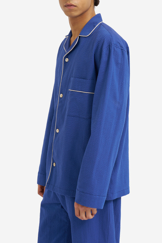 Men's long-sleeved pyjama set, 100% organic cotton seersucker, blue hour, with white piped trim.
