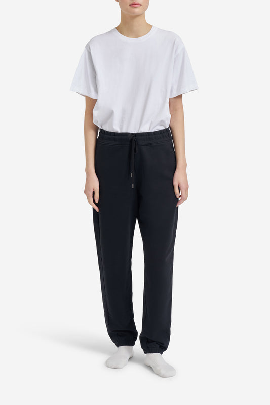 Women's jersey long-pants, organic cotton, black, with drawstring waist and embroidered logo.